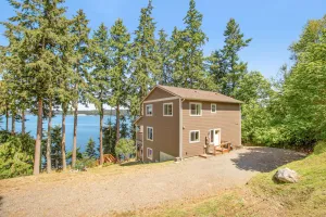 Image of Beachfront three-story home w\/deck, bay views, hot tub, game room, and WiFi