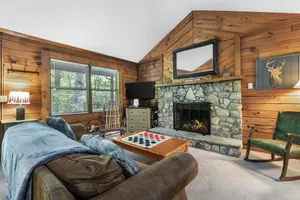 Image of Picturesque Riverside Cabin with Fireplace and Porch