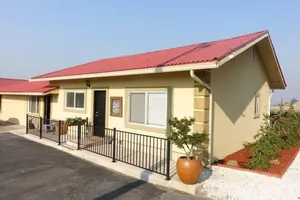 Image of Two cottages with king bed bedrooms, dining area and full kitchen.