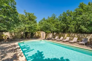 Image of GORDES Private villa and swimming pool on enclosed land planted with trees