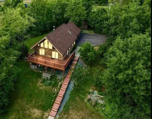 Image of \"Family Cabin: Hot Tub, Golf, Games, Sunset, Pet!\"