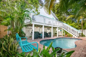 Image of Sail Away Cottage  Large Deck Overlooking Pool Steps To Sugar Sand Beach