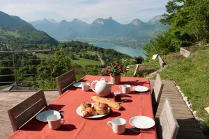 Image of Timber-frame house between lake and mountains