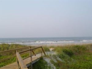 Image of Ocean-side condominium with pool. Fully-equipped for relaxed vacationing.