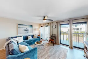 Image of Beachy second-story condo with balcony, pool, & W\/D - steps to the beach