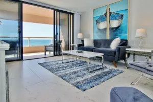 Image of 12th-floor beachfront condo with balcony, heated pool, gym, pool spa & tennis
