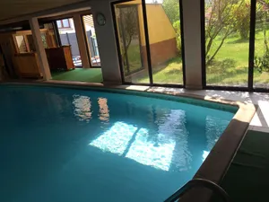 Image of Large air-conditioned room for 1 to 4 people with access to the communal swimming pool