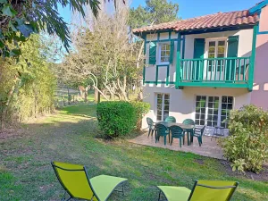 Image of House among the pines between golf course and beach