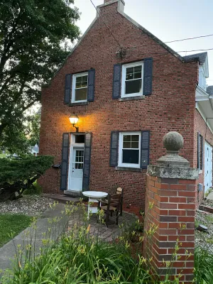 Image of Historic Steckel carriage house with picturesque landscaping