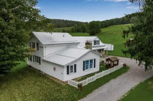 Image of Charming Farmhouse, including barn filled with horses and livestock