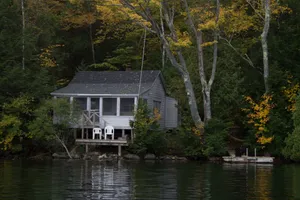 Image of Private three season cabin nestled in woods on shore of pristine Maine lake