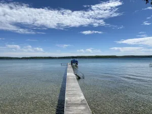 Image of Crystal Lake Waterfront Cottage with Private Dock, Yard, & Hot Tub