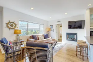 Image of Beachy & bright condo with fireplace & patio - easy walk to the beach