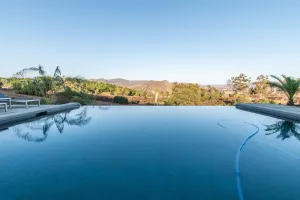 Image of Luxury Retreat w\/Views: Putting Green\/Game Room\/Infinity Pool & More!