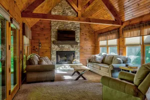 Image of Log Cabin with living room fireplace and hot tub