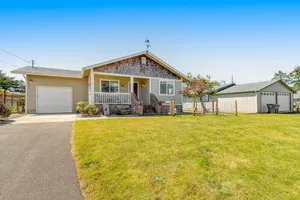 Image of Contemporary dog-friendly home with backyard, patio, washer\/dryer, pellet stove
