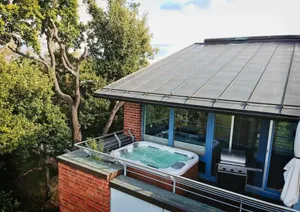 Image of Luxurious, modern loft with jacuzzi, kitchen & air conditioning