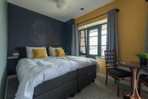 Image of Modern apartment with smart TV, private kitchen, and bathroom located in the heart of Tilburg.