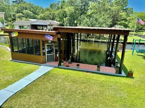Image of BEAUTIFUL WATERFRONT .  GNAT SCREENED BOATHOUSE AND AJOINING COVERED BOAT SLIPS