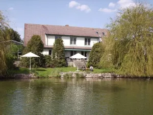 Image of Lake view vacation apartment with lake terrace, beach, jetty, boat mooring