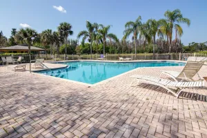 Image of Magnolias on Cobblestone – Stylish Pet Friendly Retreat w\/ Private Lanai, Pool Access & Smart TVs!