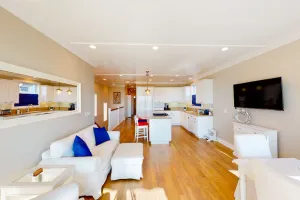 Image of Coastal-themed beachfront home with water views, grill, & beach access