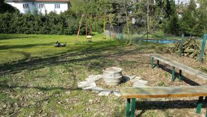 Image of Apartment near the forest with a large garden with playground and fire pit