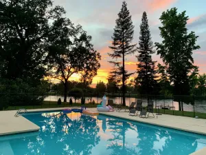 Image of Riverside Holiday House + Cottage Cool off in the Pool & Hot Tub. Sleeps 12