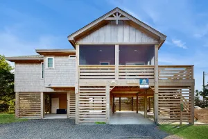 Image of Beautiful house nestled between beach & sound w\/shared pool, WiFi, & central AC