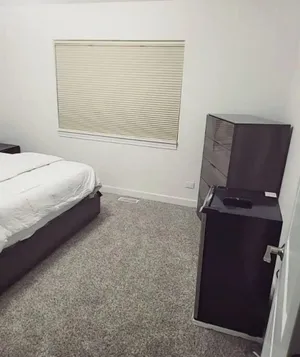 Image of A cozy bedroom in a home with high-tech amenities