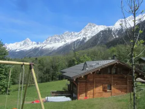 Image of chalet 4*SPA TOUT CONFORT lit fait serviette de bain vue sur toute la chaine