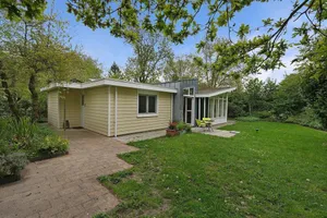 Image of A comfortably furnished holiday home by the sea with a spacious garden and privacy for 6 people.
