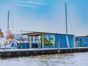 Image of Nice houseboat with waterfront terrace