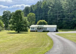 Image of Comfy Getaway w\/ stream and bridge out back