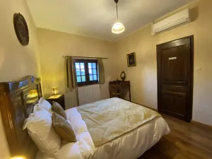 Image of Quiet, cozy Ravel room with TV and air conditioning