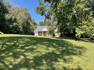 Image of 1 extra large bedroom in the woods with pool table and hot tub.