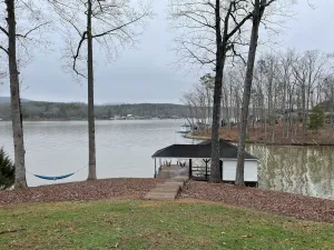 Image of Lake Front House with Dock, Kayaks, and Boat Slip