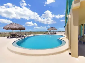 Image of Breezy Belleair Beach condo with on-site pool, sundeck, & private beach access