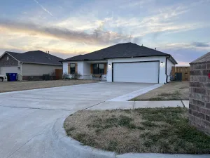 Image of Welcome to Innovators Home Broken Arrow with Large Driveway