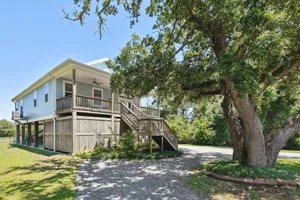 Image of Cozy cottage surrounded by woods and just a short walk to the beach!!