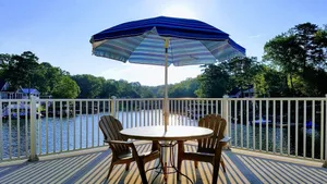Image of Lakefront Luxe Retreat in Tranquil Cove  Endless Enjoyment  Lakeside Fireplace
