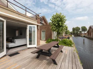 Image of luxury apartment with waterside terrace