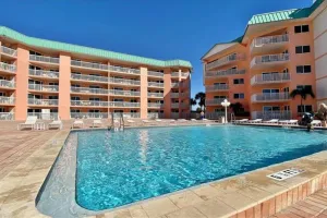 Image of Beachfront condo with balcony, pool, hot tub, grill, & AC