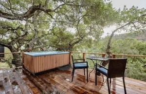 Image of New! Soak in a Hot Tub at this Romantic Tree House Surrounded by Trees