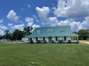 Image of Gated Farmhouse on 93 acres pool & access to red creek from property.