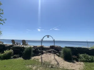Image of Cozy home on the bay with sand beach and beautiful sunrises!🌅