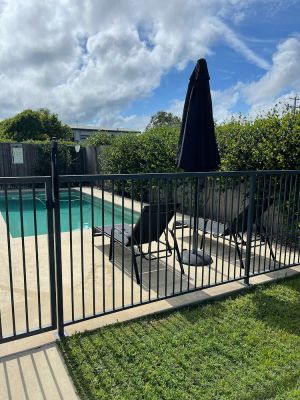 Image of Compact single level home with pool and huge fenced yard