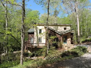 Image of Falling Waters - 150' Waterfall right behind the house!