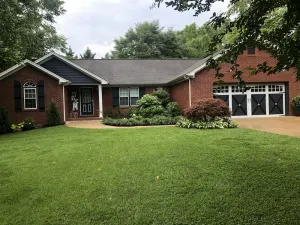 Image of one level brick home with pet friendly fenced back yard , close to Chattanooga