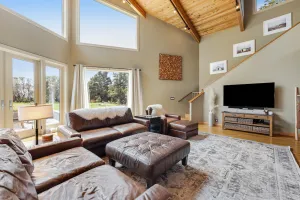 Image of Enjoy a private hot tub, deck, distant ocean view, fireplace, and pool